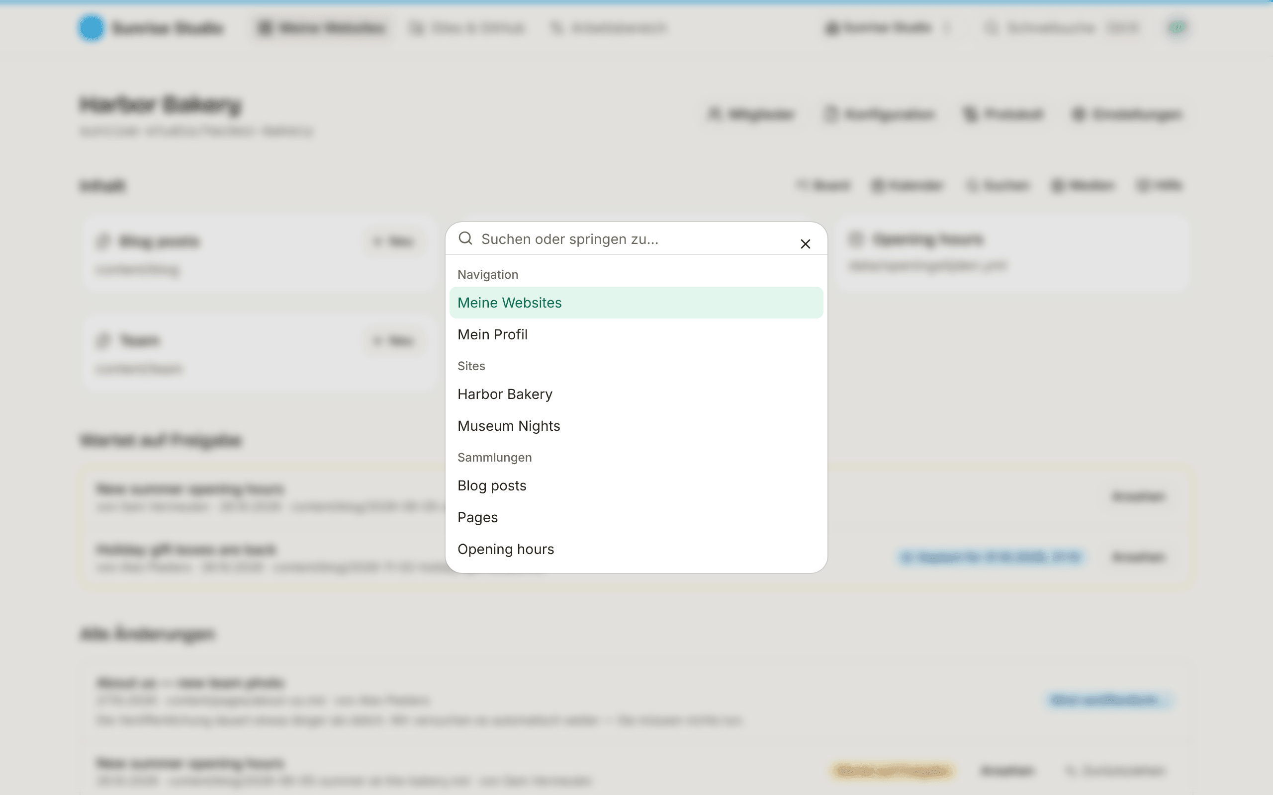 Die Befehlspalette über einer unscharfen Site-Seite: ein Feld „Suchen oder springen zu…“ mit Gruppen für Navigation (Meine Websites, Mein Profil), Sites und Sammlungen
